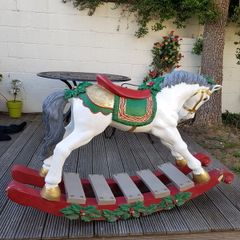 large Christmas rocking horse on a bow