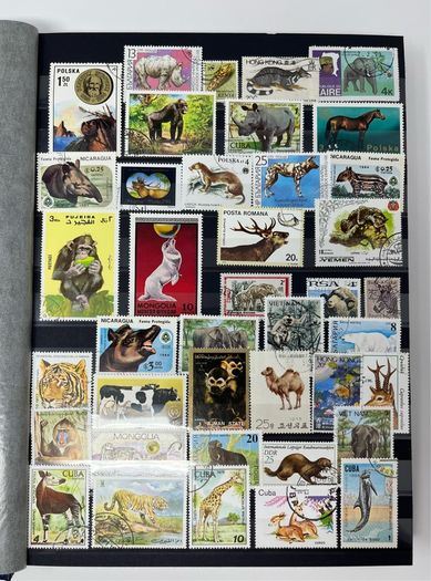 Ace Black 32 page/ 16 leaf Stamp Album with over 900 stamps. Thematic of Animals, Plants, Classic Cars, Space, Trains, Sport & Disney noted.