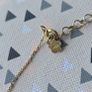 925 sterling silver bracelet with yellow gold plating and V shaped pendant. Image 4