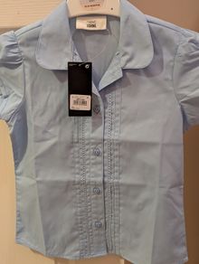 Short sleeve next blouses and navy shorts for under pinafore