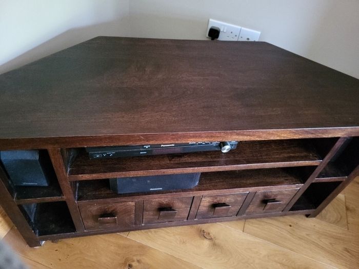 TV corner unit (walnut) with storage.