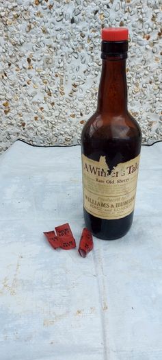 vintage bottle of winters tale sherry 3/4 full ,found in a old pub closed down,