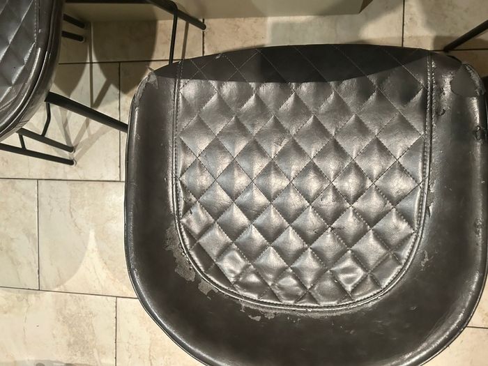 Three  black quilted kitchen bar stools