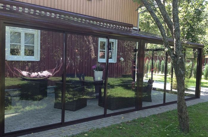 Tempered glass pergola with sliding door