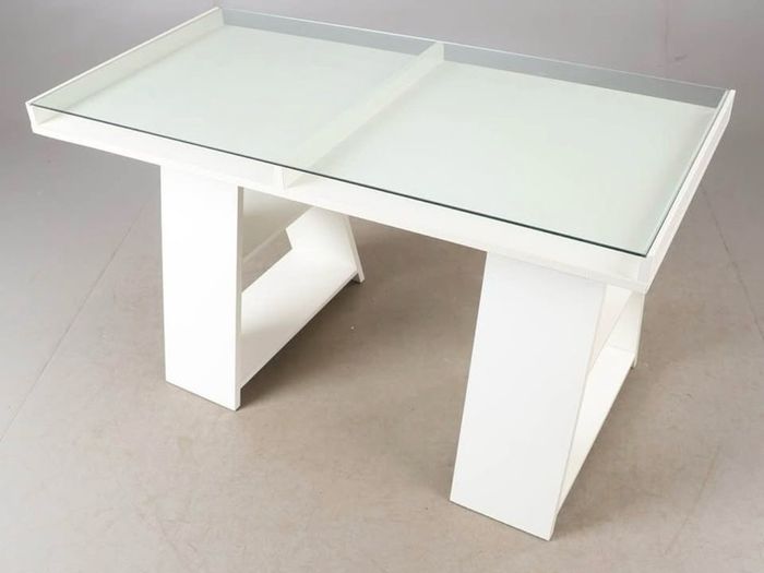 Study/ Office table Used but in great condition This is a modern minimalist table with a sleek white finish and a glass top