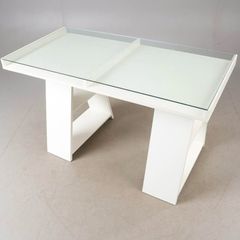 Study/ Office table Used but in great condition This is a modern minimalist table with a sleek white finish and a glass top