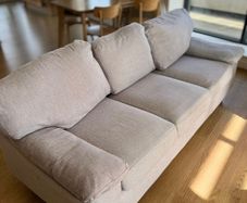 light gray three-seater sofa