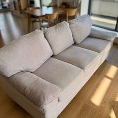 light gray three-seater sofa