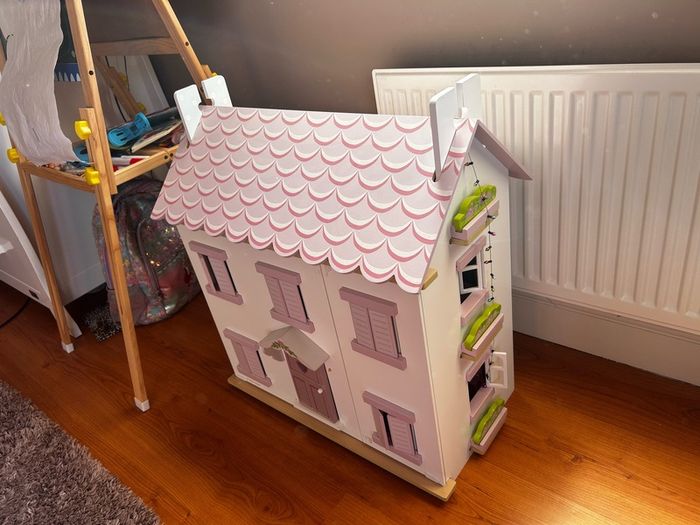 Wooden dolls house with accessories