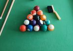 Pool table with cues and balls