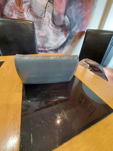 Grey Faux Leather  clutch bag .