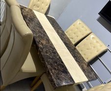 marble dining table and leather chairs