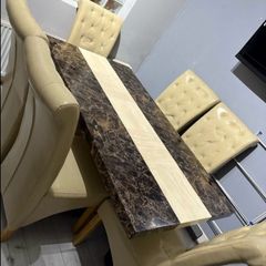 marble dining table and leather chairs
