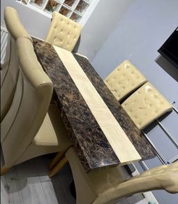 marble dining table and leather chairs