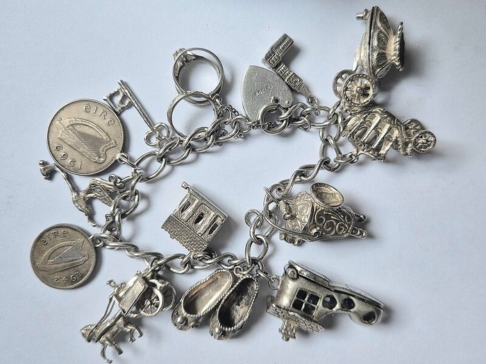 Vintage Irish Sterling Silver 14pc Charm Bracelet, Thomas O'Connor Charm Maker. Inc 1942 Pre Decimal Threepence, Dated Heart Padlock, Dublin Hallmarked