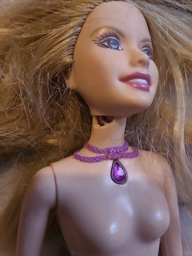 4 barbie dolls