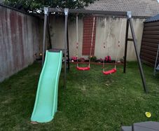 Double swing set with slide.