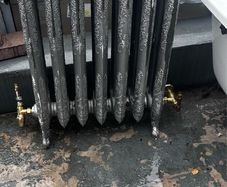 Cast iron radiator in perfect condition with period brass rad valves