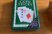 A tin of card tricks set