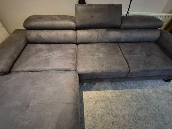dark grey corner sofa with sleeping and storage
