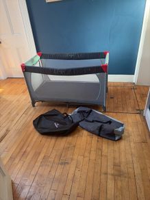Travel cot including additional mattress