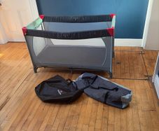 Travel cot including additional mattress