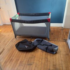 Travel cot including additional mattress