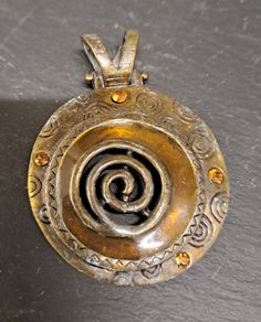 Copper pendant with orange crystals