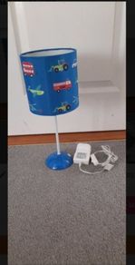 Childrens beside lamp