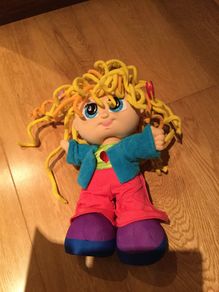 Curley Q doll