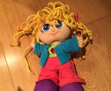 Curley Q doll