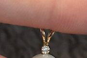 Small pearl pendant or charm with solid yellow 14k gold and a tiny diamond (real) not lab grown