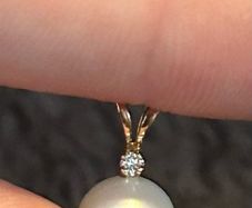 Small pearl pendant or charm with solid yellow 14k gold and a tiny diamond (real) not lab grown