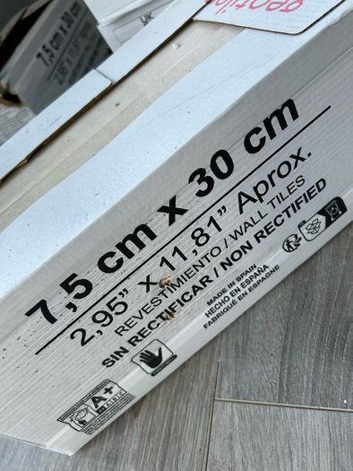 3 boxes tiles and adhesive