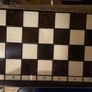 A stunning box of wooden chess pieces and board Image 2