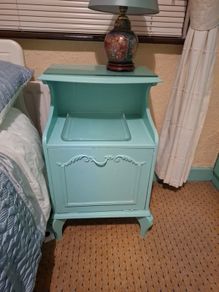 Turquoise bedside locker.
