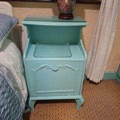 Turquoise bedside locker.