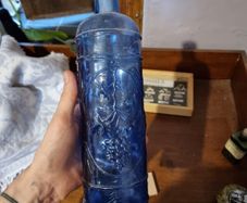 Vintage bottle cobalt blue with grapes