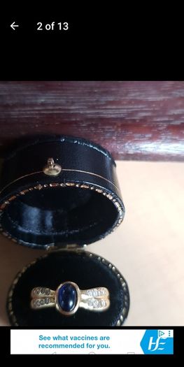 18 ct gold ring with Sapphire stone and 16 brilliant cut diamonds