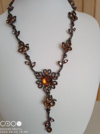 Victorian revival aesthetic  dark antiqued metal with warm amber tones