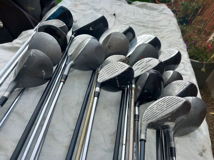 A selection of golf clubs and bags. NOT SELLING SEPARATE
