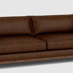 Two distressed leather sofas and a fabric sofa bed