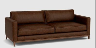 Two distressed leather sofas and a fabric sofa bed