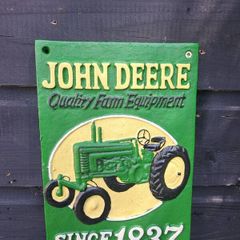 John deer cast iron sign