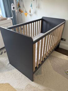 Next navy and pale oak cotbed