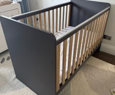 Next navy and pale oak cotbed