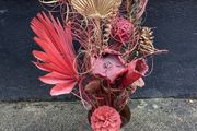 Dried flower arrangement in glass vase