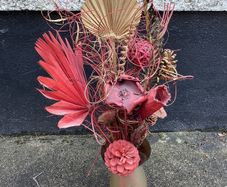 Dried flower arrangement in glass vase