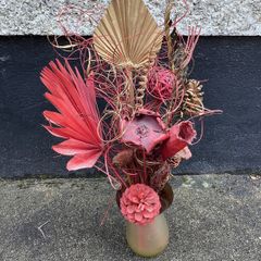 Dried flower arrangement in glass vase