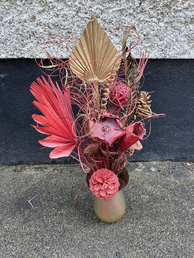 Dried flower arrangement in glass vase